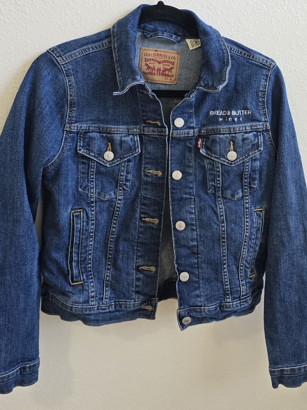 Levi's Dark Blue Denim Trucker Jacket with 'Bread & Butter Wines' Embroidery